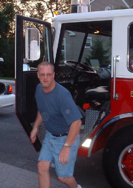 Past Chief Allen Fowler driving Engine 1 to dumpster fire.