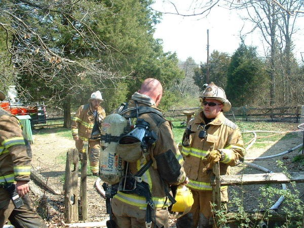 Deputy Chief Obenchain getting the updates from the interior crew on a Barren Road house fire.