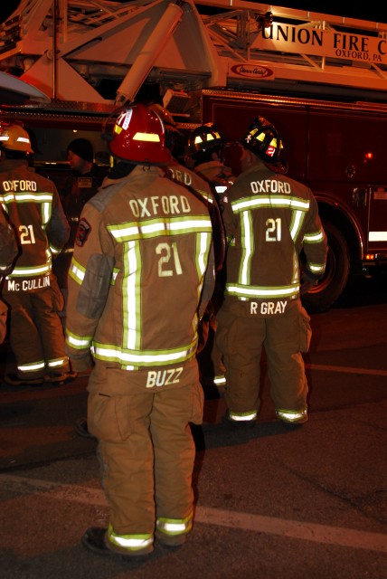 Junior Firefighter Brian Slauch watching crews work at a fire.