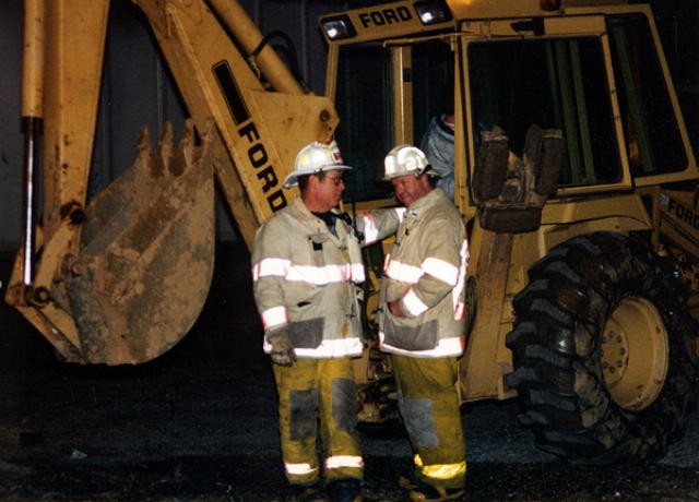 Deputy Chief Terry and Chief Prettyman at fire behind the old Ames store.