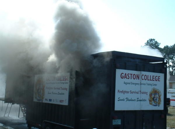 Members participate in a flashover simulator at the Orlando Fire Conference.