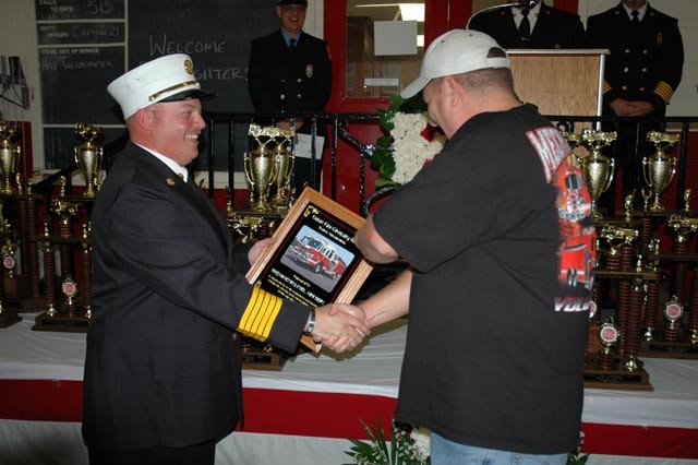 Chief Obenchain presenting Chief Raley (Mechanicsville) with a plaque in appreciation for their help.