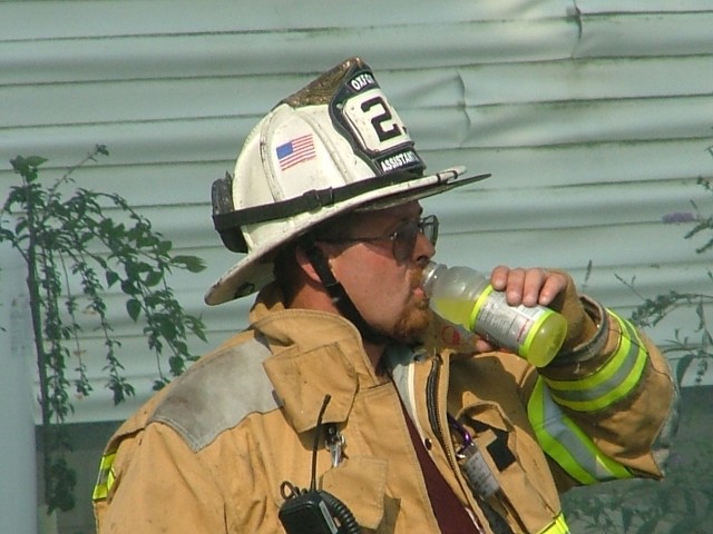 Assistant Chief Mark Vining on a break at barn fire on Forge Road.