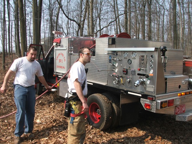 Bob Prettyman and Brian Kelley with Tac 21 at a woods fire on Conner Road.