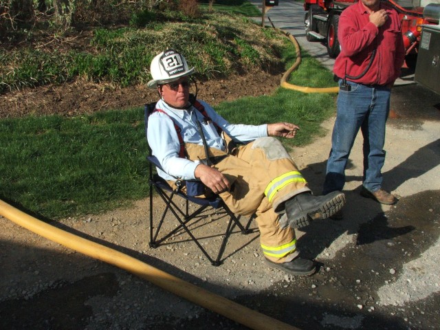 Deputy Chief Terry relaxing at a barn fire in Cochranville.