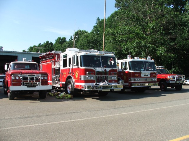 Brush 21, Engine 21-1, Engine 21-3, and Tac 21 lined up along Park Road for Freedom Fest.