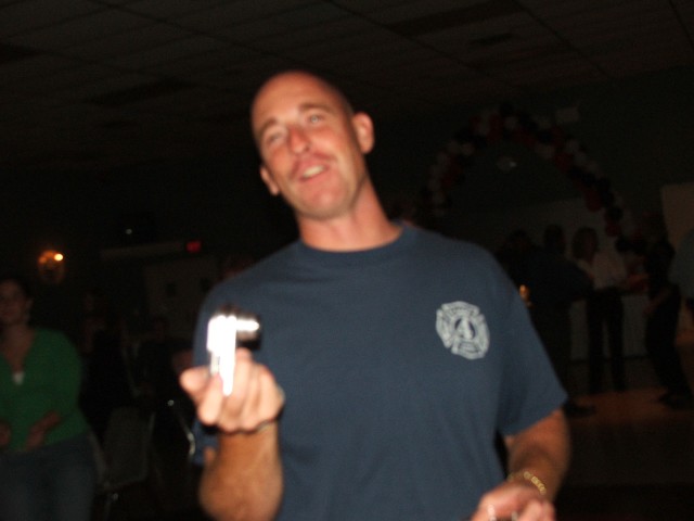 Dave Messaros snapping photos after a banquet.