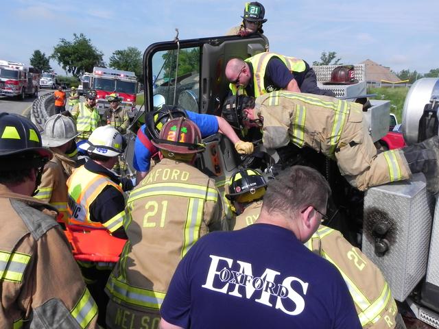 Oxford and Cochranville crews work to free the driver.