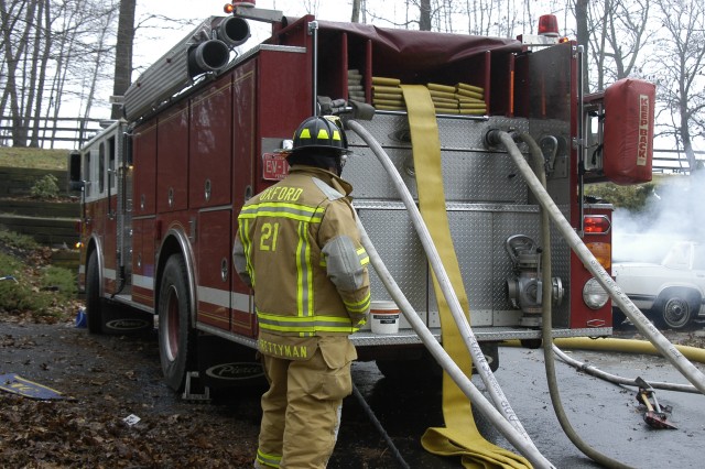 Past Chief Jim Prettyman pumping Engine 4 on a house fire in Elk Township.