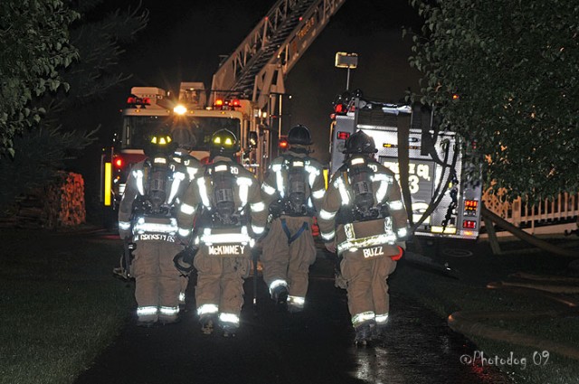 (L-R) Matt Groseclose, Jay McKinney, Dave McCormick, and Brian Slauch heading into the scene of a Rising Sun fire in 2009.