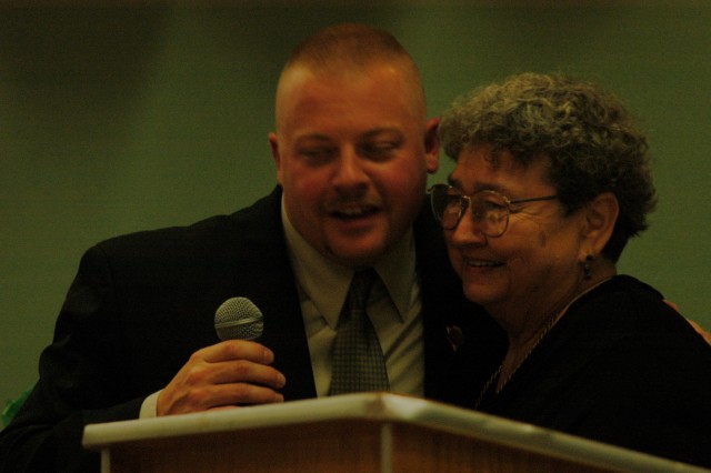 Chief Obenchain thanks Ladies President Betty Slauch for a gift at a Company banquet.