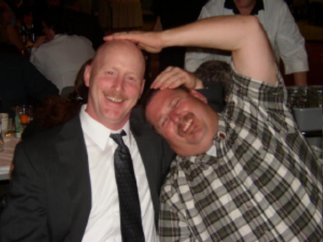 Tim Kelly, Sr. and Donald Slauch at a banquet.