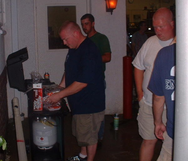 Deputy Chief Obenchain cookin' burgers on front ramp.