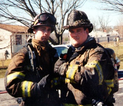 Firefighters Dave Messaros and Sam Terry after a house fire on Hall Road.