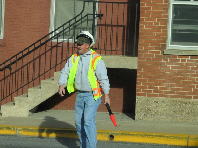 Firefighter Randy Gray assisting with traffic control in front of the Mid-Town Station.