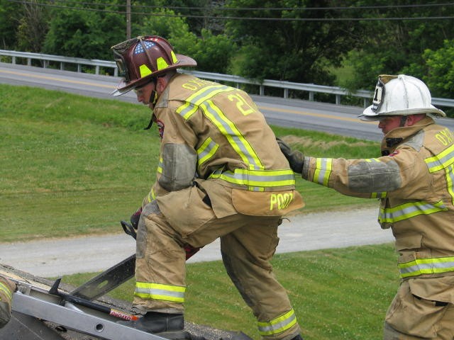 Firefighter Morgan Derr getting some roof venting practice.