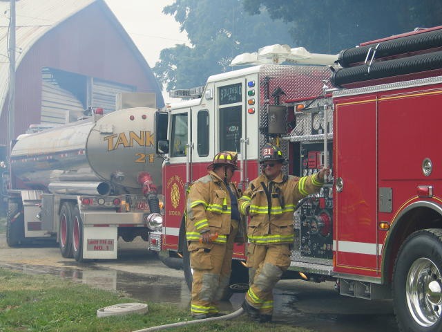 Operators Donald Slauch and Steve Gray supplying water at a training.