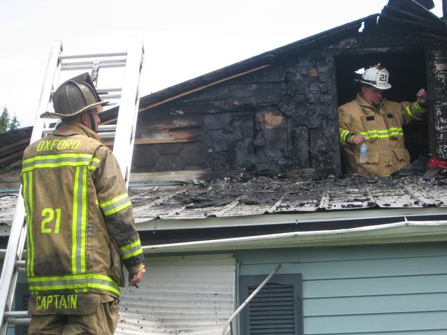 Captain Bob Prettyman and Fire Chief Sam Terry discussing the incident.