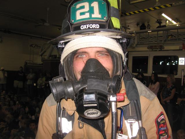 Firefighter Bill Hirthler prepares for Fire Prevention.