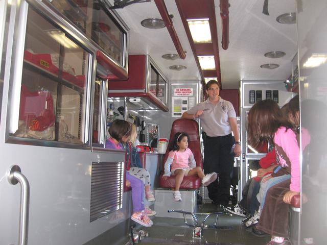 Kids getting a tour of an Ambulance.