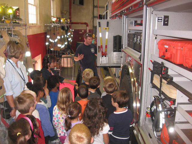 Hoseman Matt Groseclose giving a tour to a group of local kids.