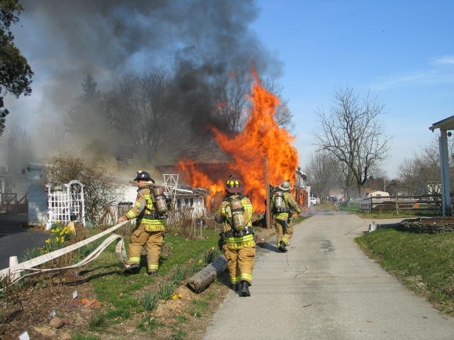 Crews stretching the initial line at a garage fire on Market Street.