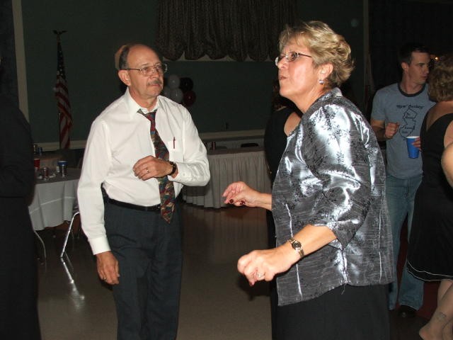 Myron and Janet Wagner cutting a rug at a company banquet.