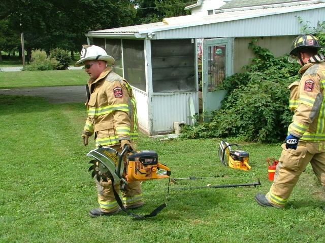 Chief Obenchain teaching the saw portion of a Truck Class.