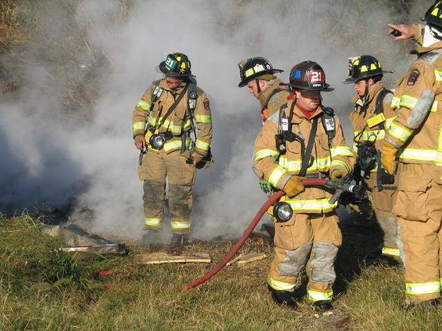 Firefighter Bob Stewart mans the booster line at mushroom house fire on Old Baltimore Pike.