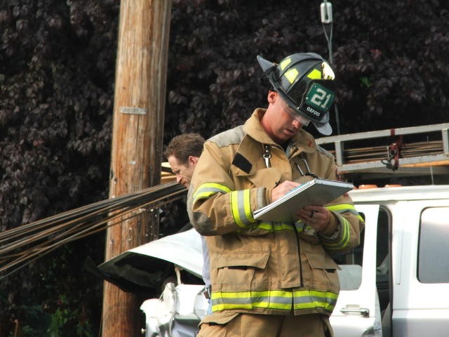 Firefighter/EMT Dave Messaros obtaining more patient information from a crash at Route 272 and Lees Bridge Road.