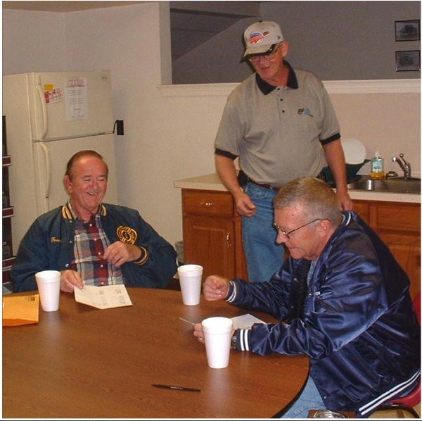 Past President Frank Moroney, Steve Hoffman, and Ed Holbrook sitting around the old coffee table.