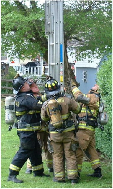 The RIT crew throwing ladders a Parkesburg house fire.