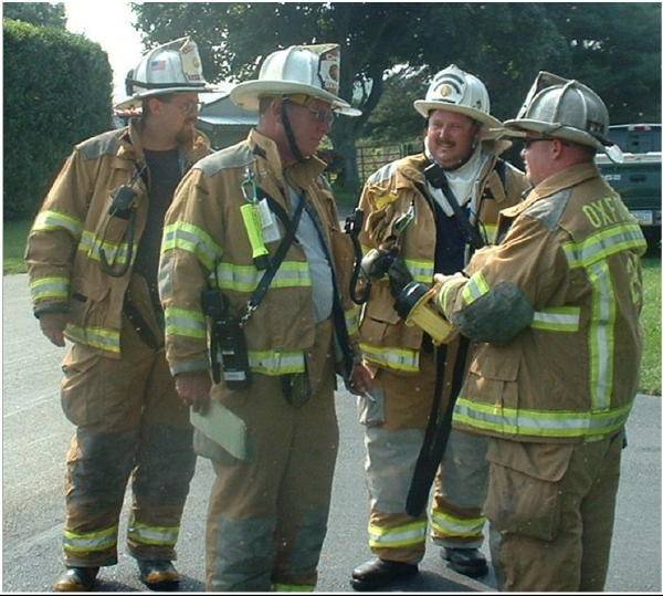 Assistant Chief Mark Vining, Fire Chief Rich Terry, Lieutenant Donald Slauch, and Deputy Chief Chris Obenchain at a reported house fire on Chrome Road.