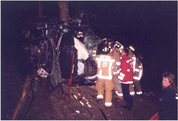 An overturned car against a tree with entrapment on Route 272.