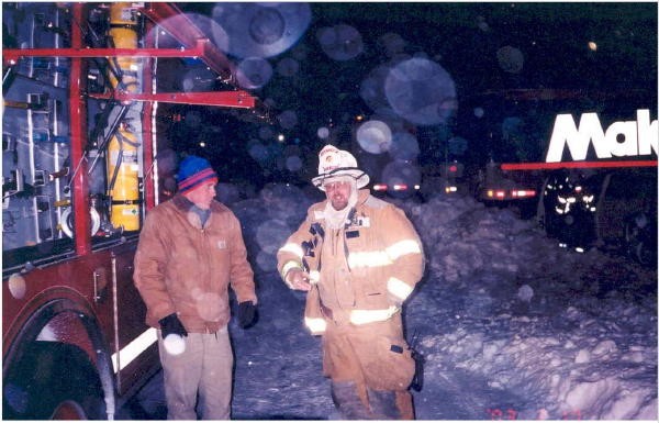 Firefighter Dave Messaros and Assistant Chief Mark Vining at a car fire at Herrs.