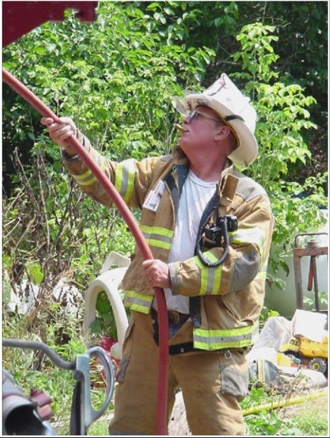 Fire Chief Rich Terry with a booster line at a Cocrhanville house fire.