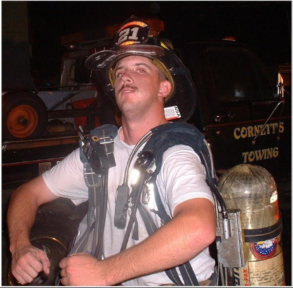 Randy Gray posing after a building fire in Nottingham.