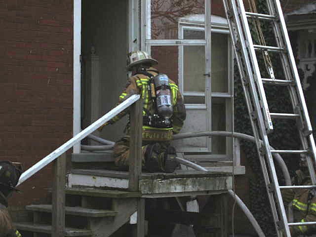 Fire Chief Rich Terry humping hose at Pine Street fire.