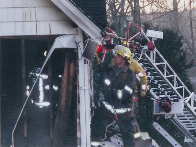 Firefighter Dave Messaros doing some overhaul on Spring Valley Road.