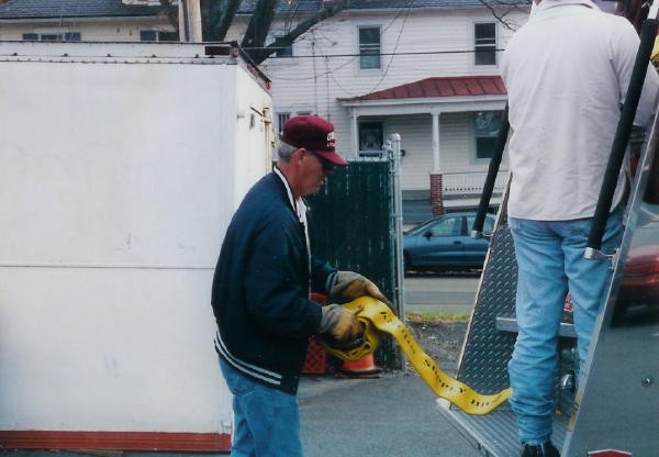 Firefighter Steve Hoffman helping to rack the 5&quot; hose.