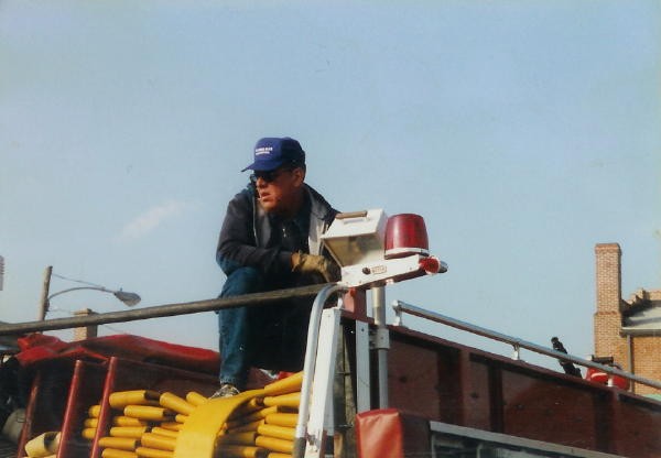 Past Chief Terry racking the new 5&quot; hose onto Engine 1.