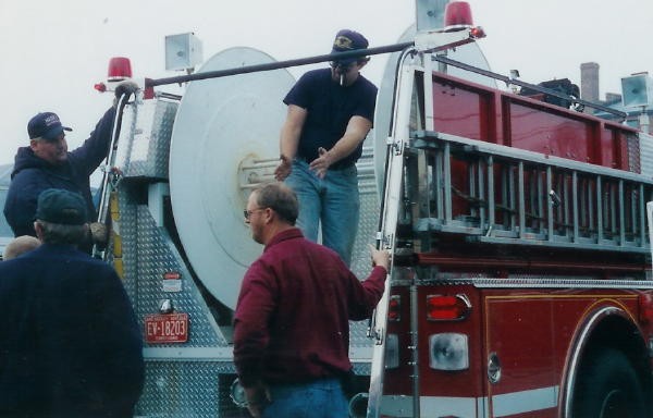 Mark Vining explaining how he would like the 5&quot; supply hose to go onto Engine 2's reel.