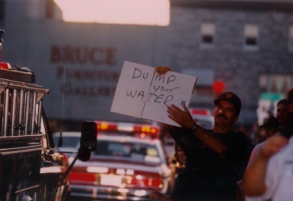 Firefighter Jeff Lawrence asking trucks to &quot;Dump their Water&quot; when leaving a parade.