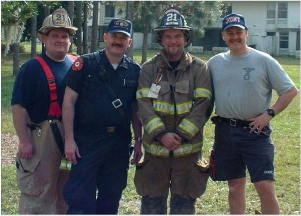 Captains Sam Terry and Bill Gray with retired Battalion Chief John Salka (FDNY) and another firefighter at the Orlando Fire Conference.