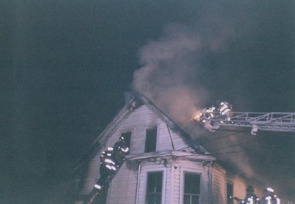 Ladder 21 venting the roof on a West Grove house fire.